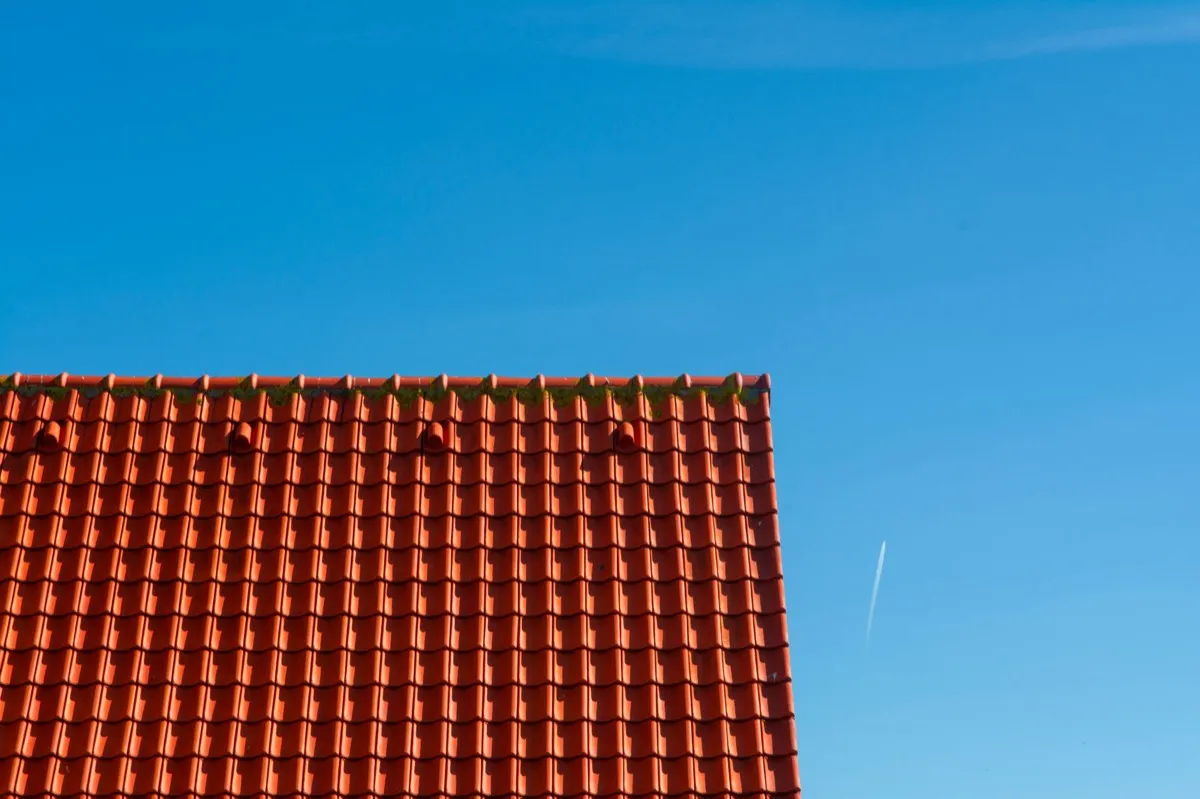 Tile roof gable in full sun, the kind of exposure that sets roof life in Tigard, OR